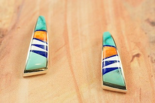 Genuine Sleeping Beauty Turquoise, Spiny Oyster Shell, Magnesite and Blue Lapis inlaid in Sterling Silver. Beautiful Post Earrings Designed by Navajo Artist Calvin Begay. Signed by the artist.